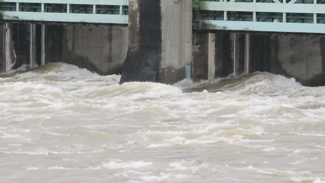 Water surging through dam spillway after torrential rainfall in South Korea