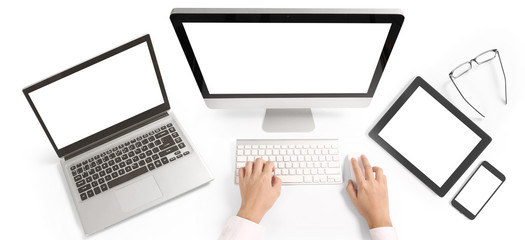 Hand on desktop keyboard with blank screen monitor