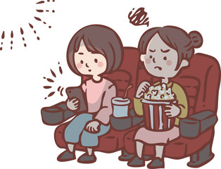 映画上映中にスマートフォンを見る女性