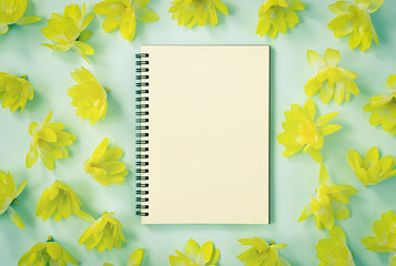 Spiral Notebook or Spring Notebook in Unlined Type and Yellow Flowers on Blue Pastel Minimalist Background in Vintage Tone