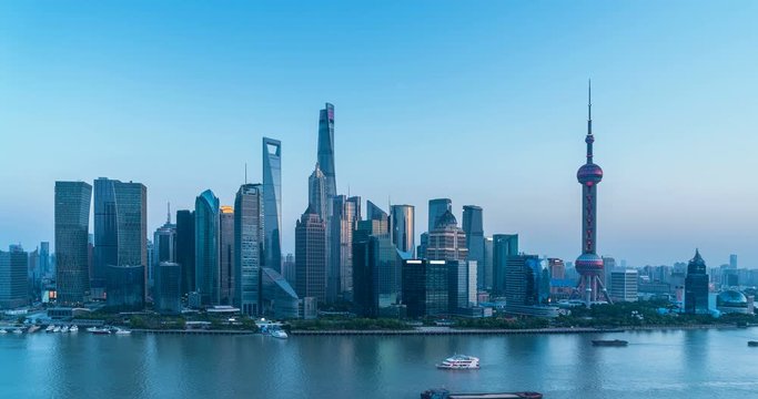 time lapse of shanghai skyline in nightfall, lujiazui financial center with huangpu river at dusk ,China
