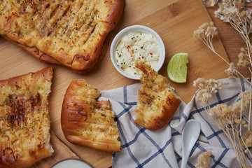 Spice naan bread with sour dipping cream