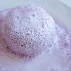spa composition soap with salt bombs on a pink background, the concept of relaxation and body care