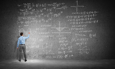 Student or teacher at blackboard