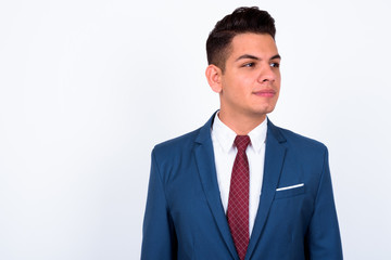 Portrait of young handsome multi ethnic businessman in suit