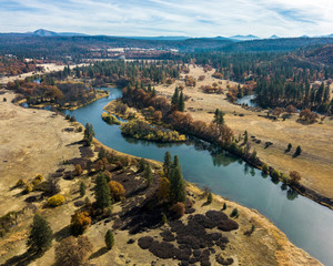 Fototapeta premium Autumn Rest - The Pit River flows serenely through Hat Creek Valley, with Bald Mountain and Lassen National Forest in the background. Cassel, CA, USA