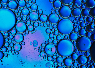 Abstract colorful bubbles. Mixing water and oil. Unrealistic colored blue bubbles. Can be used as a festive background