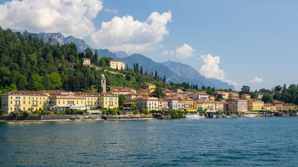 Fototapeta na wymiar Bellagio, Italy. Amazing view of the village from the boat. Bellagio one of the most famous Italian place in the world. Best of Italy. Como lake. traditional Italian landscape. Summer time 