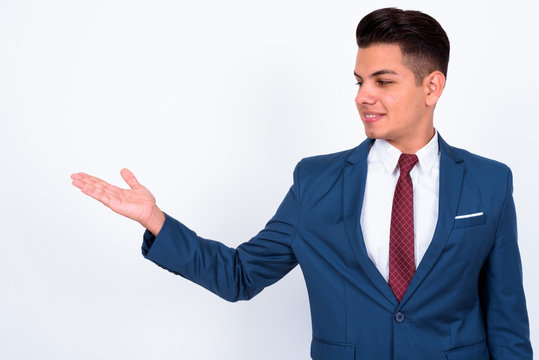 Portrait of happy young handsome multi ethnic businessman in suit