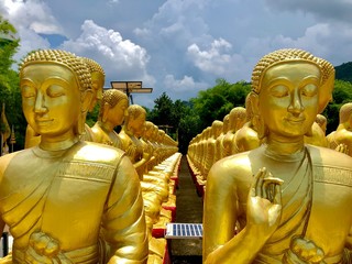 Many monks' statues make prayers in Makha Bucha Buddhist Memorial Park,Thailand