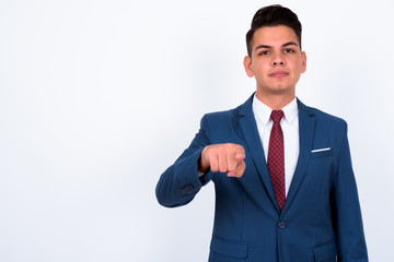 Portrait of young handsome multi ethnic businessman in suit