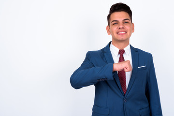 Portrait of happy young handsome multi ethnic businessman in suit