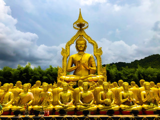 Many monks' statues and Buddha make prayers in Makha Bucha Buddhist Memorial Park,Thailand