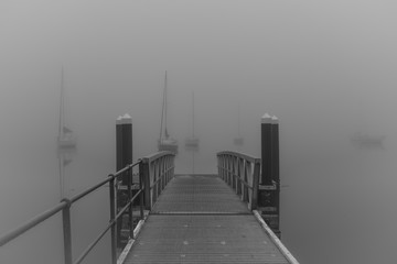 Wharf and Boats in the Fog in Black and White