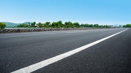 city road through modern buildings in China