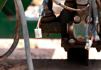 Close up view. Old connector socket joints that were disconnected hanging outdoors.