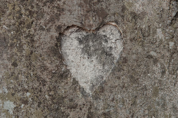 The shape of a heart on a concrete wall