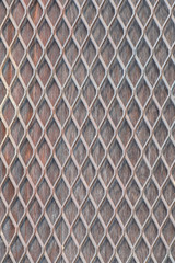 texture background of crossed metal net on top of the wooden fence