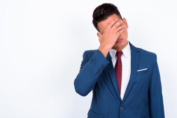 Portrait of young handsome multi ethnic businessman in suit