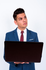 Portrait of young handsome multi ethnic businessman in suit