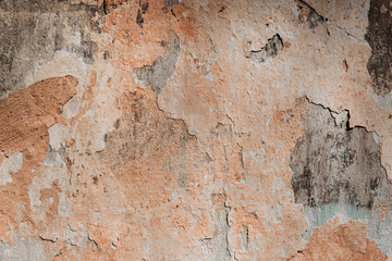 The texture of the old painted wall with which the plaster is peeled off and mold is visible. Background,