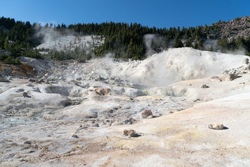 Lassen Volcanic National Park. Rocky trail with grand vistas descends to a boardwalk through Lassen's largest hydrothermal area. Trailhead at Bumpass Hell Parking area.