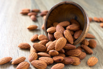 Almonds on the wood background,copy space.