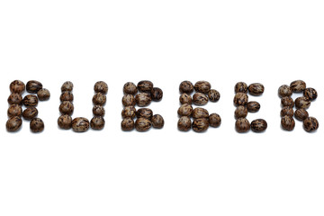 Rubber seeds arranged in words 