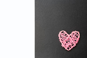 Pink wooden heart design on black and white paper texture background, love and romance symbol, valentine concept card background