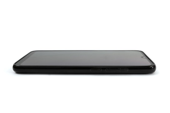 black smartphone isolated on white background. Side view. Copy of space.