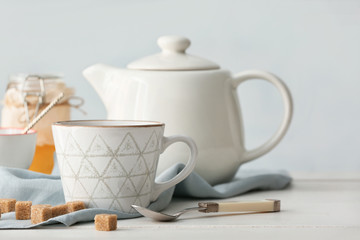 Composition with hot tea on table