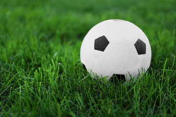 Soccer ball on green grass outdoors