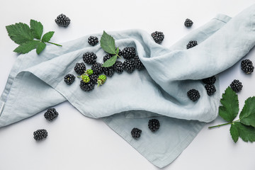 Ripe tasty blackberry on white background