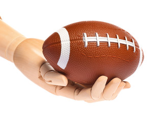 Hand of mannequin with rugby ball on white background