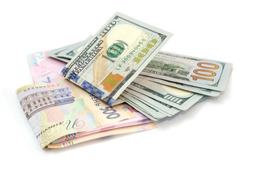 dollars and hryvnia isolated on white background.
