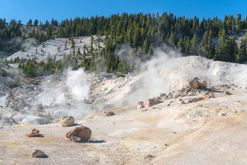 Lassen Volcanic National Park. Rocky trail with grand vistas descends to a boardwalk through Lassen's largest hydrothermal area. Trailhead at Bumpass Hell Parking area.