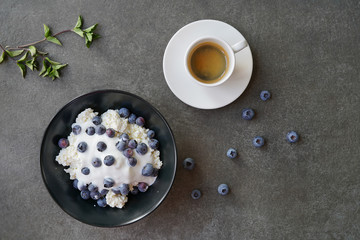 Cup of coffee, ricotta and blackberries