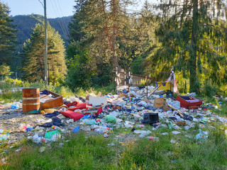 Filled trash bins outdoors in mountain area