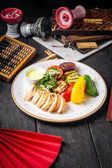 Chicken breast with grilled vegetables and sauce