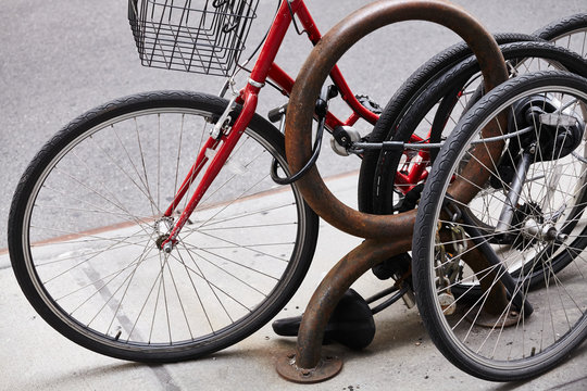 Close up picture of locked bicycle wheels, New York City, USA.