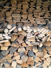 Woodpile for a fire, made of pine and birch boards