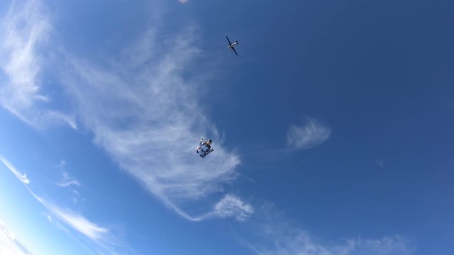 Skydiving. A military girl is flying in the sky.