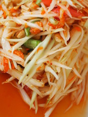 Thai food, Som-Tum, or Thai-style papaya salad with closeup and selective fucus