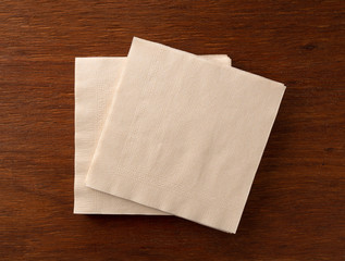 Paper napkins on a wooden background