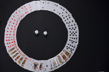 Playing cards on a black background.
