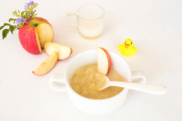 mix apple mashed with milk healthy foods health care for baby eats breakfast arrangement flat lay style on background white 