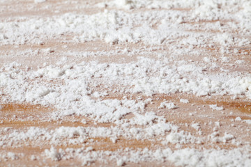 wheat flour on a wood board. close-up.