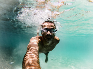 Underwater selfie spanish young man