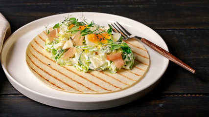 Food banner format. Fresh vegetable salad with smoked chicken, eggs, greens and black sesame seeds, wheat tortillas. Restaurant salad recipe.