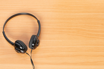 headphones on a wooden background.